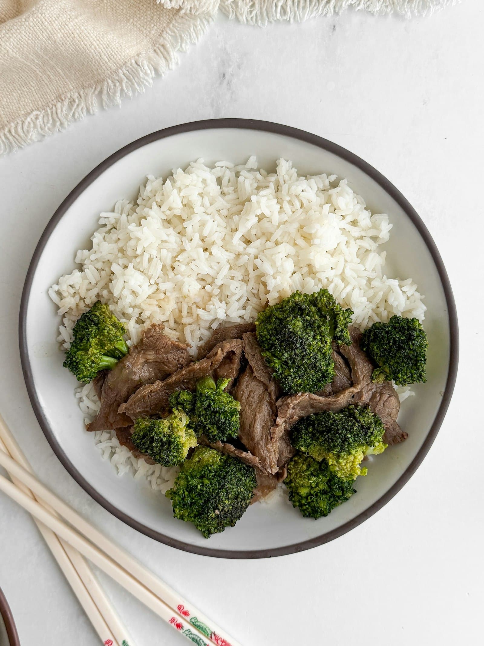 Beef and broccoli served over white rice