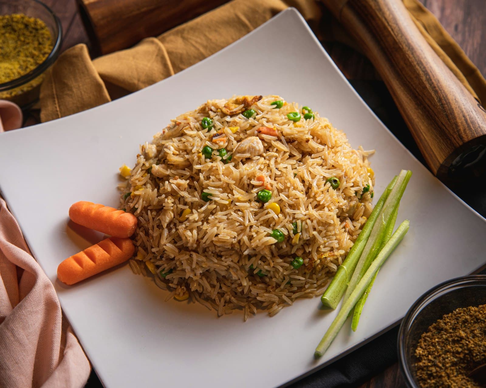 A mound of fried rice on a white plate