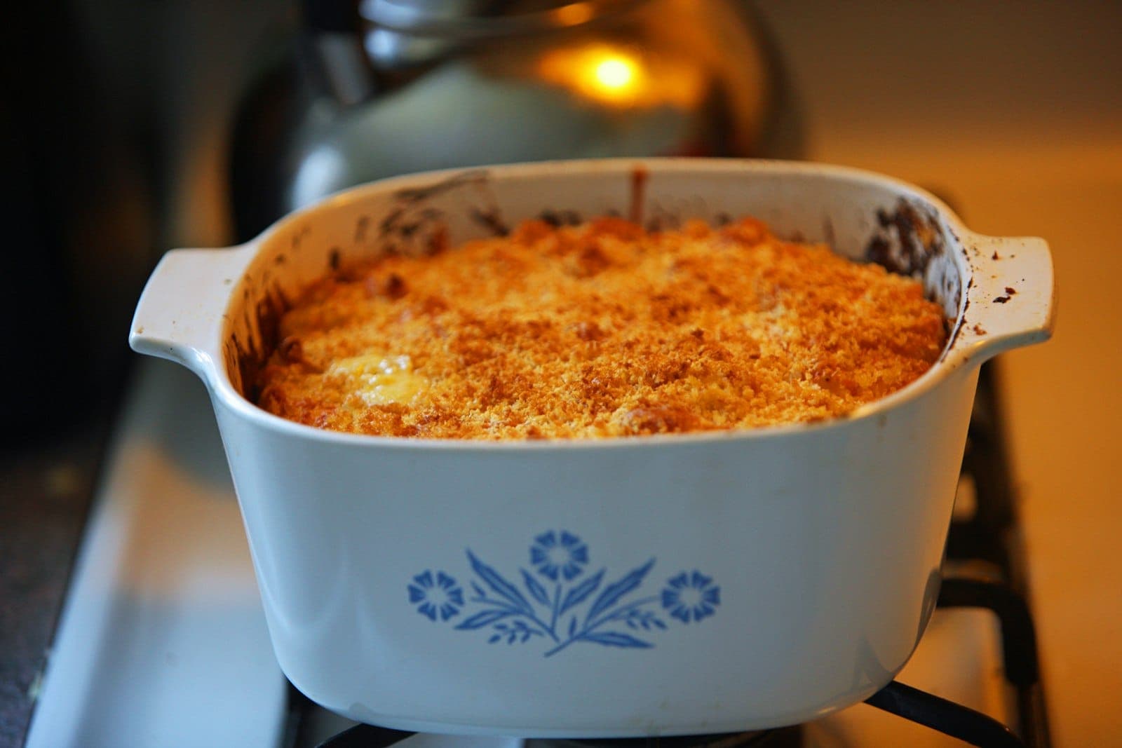 Baked macaroni and cheese with a golden breadcrumb topping in a casserole dish