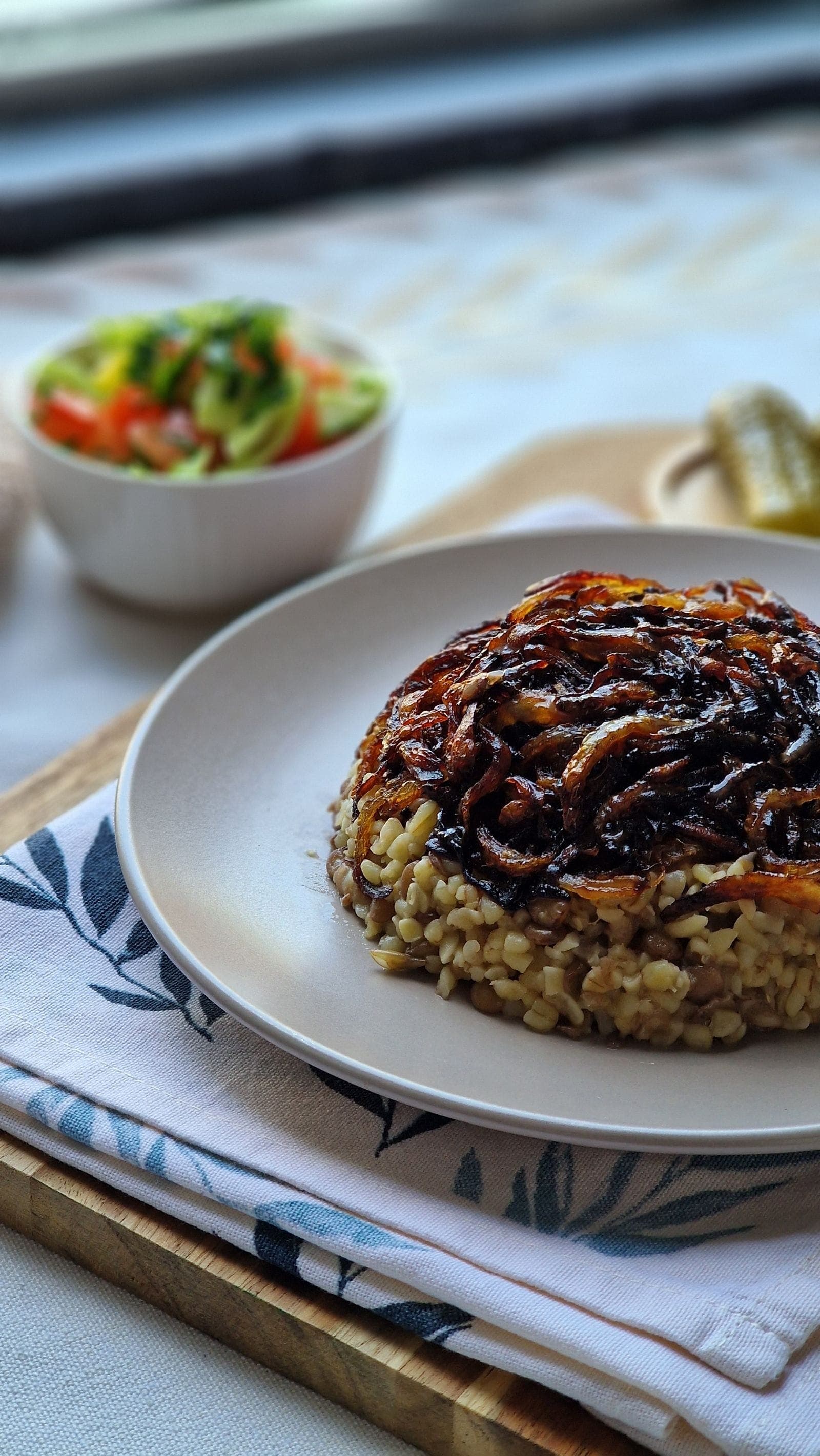 Lentils and grains topped with a heap of dark caramelized onions