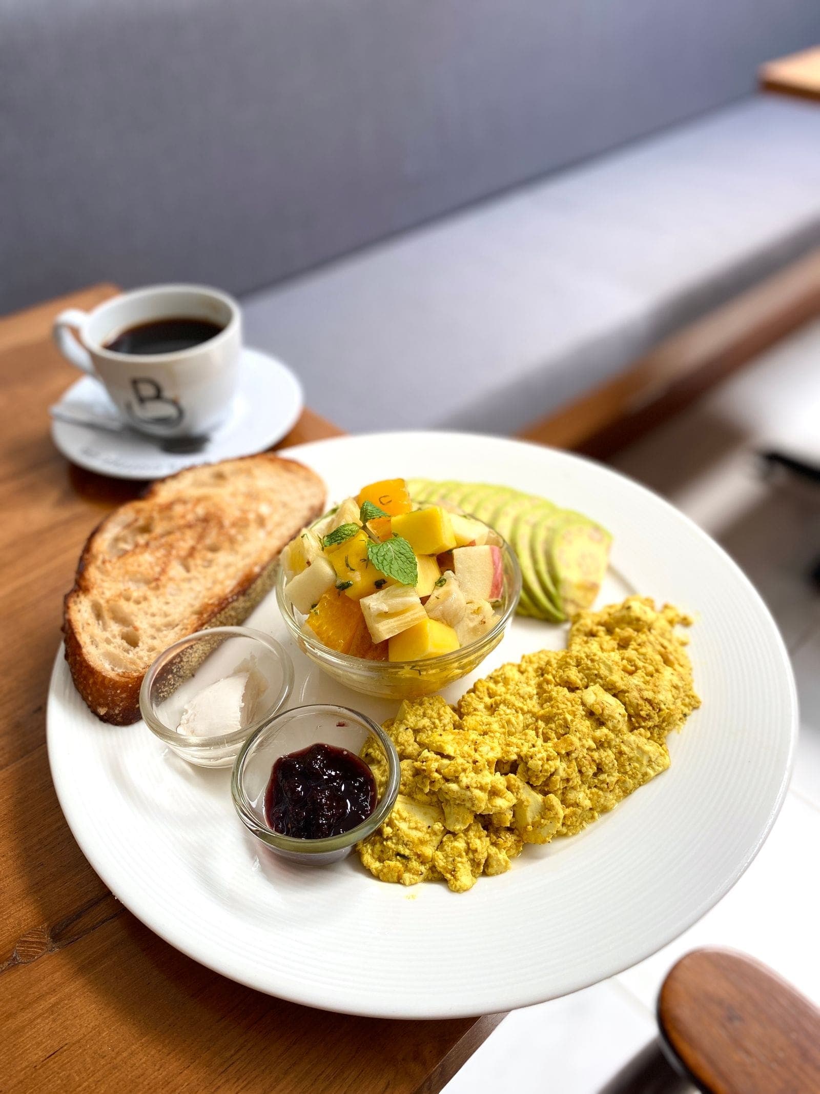 Turmeric tofu scramble with toast, avocado and fruit